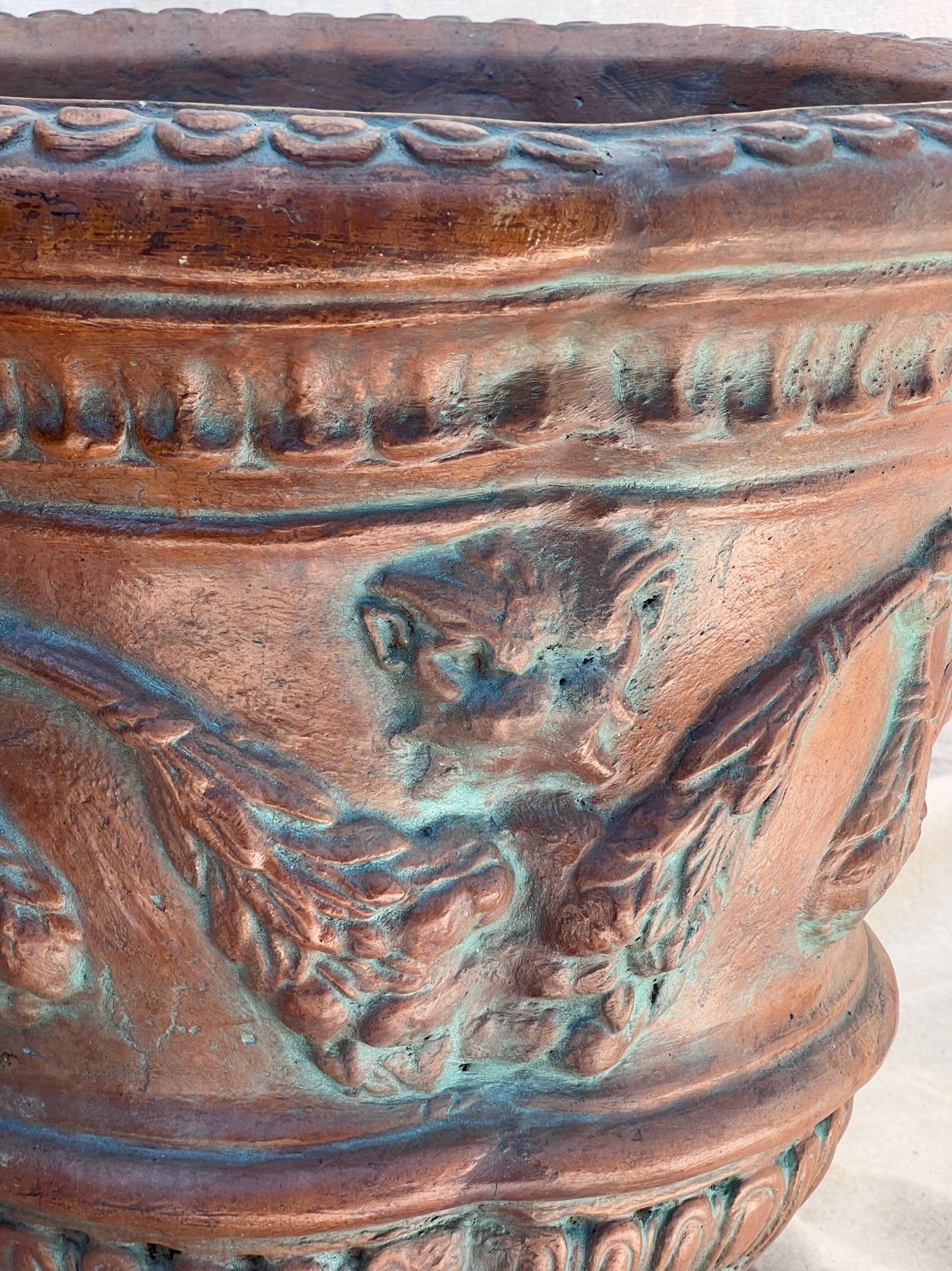 Close-up of the Silvestri Terracotta Ornate Planter (Set of 2) highlighting intricate details and blue patina, hommes + gardens estudio.