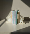 Pair of 1960s vintage white onyx bookends from Mexico, handcrafted with natural stone texture and rustic mid-century charm — Hommes and Gardens, Decorative Collection, Landscape Architect, Interior Designer, Outdoor Living, Outdoor Decorations, Home Decor, Home Design, Luxury Design, Art, Furniture, Objects, Best Gifts, Nature, Backyard, Yard.