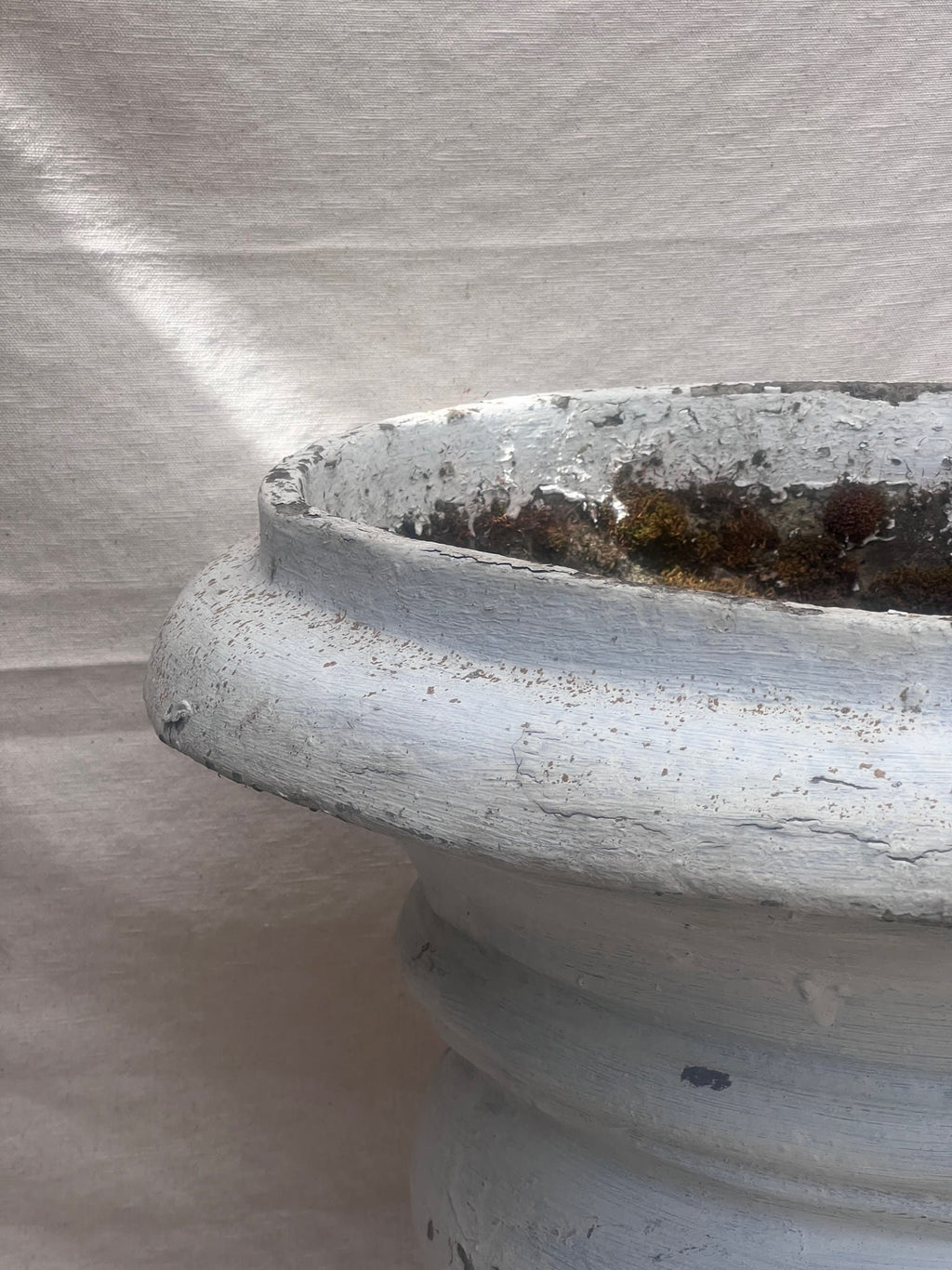 large outdoor concrete urn planter with patina