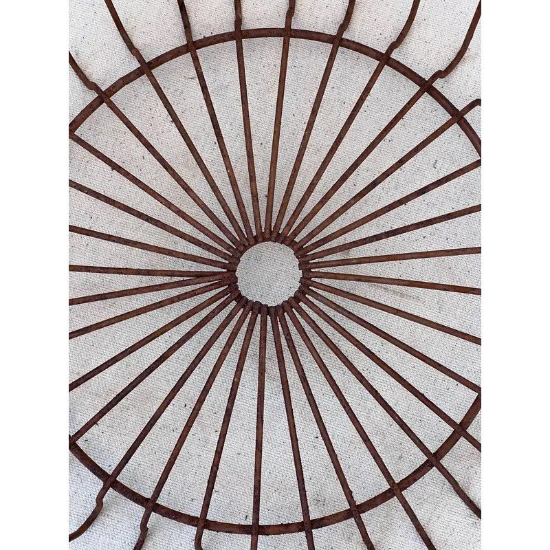 Close-up view of a Primitive Egg Gathering Wire Basket showcasing its open-wire design and rustic charm. hommes + gardens estudio.