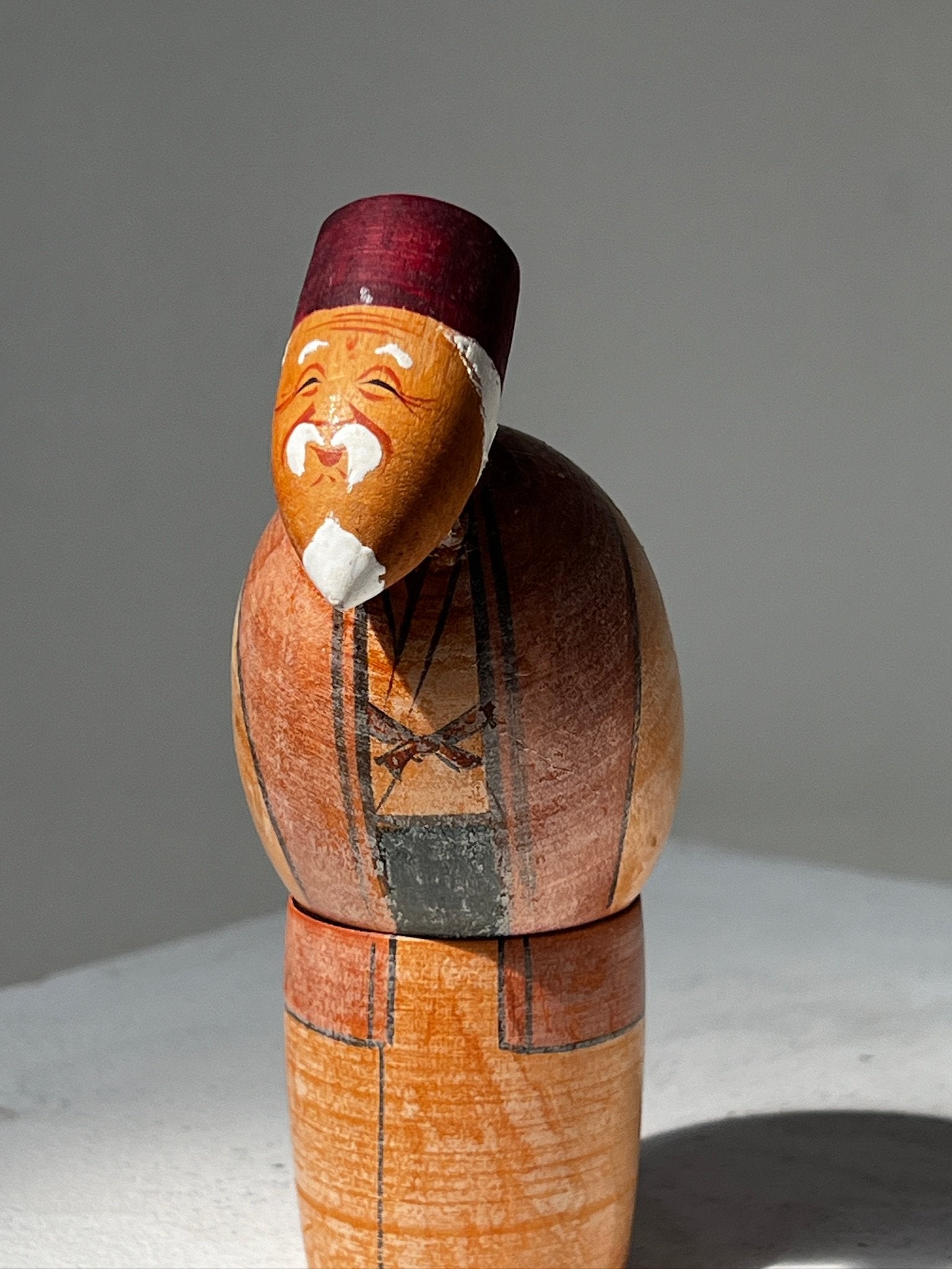 Vintage Takasago Kokeshi Japanese "Jō" Wood figurine smiling with traditional hand-painted design, hommes + gardens estudio.