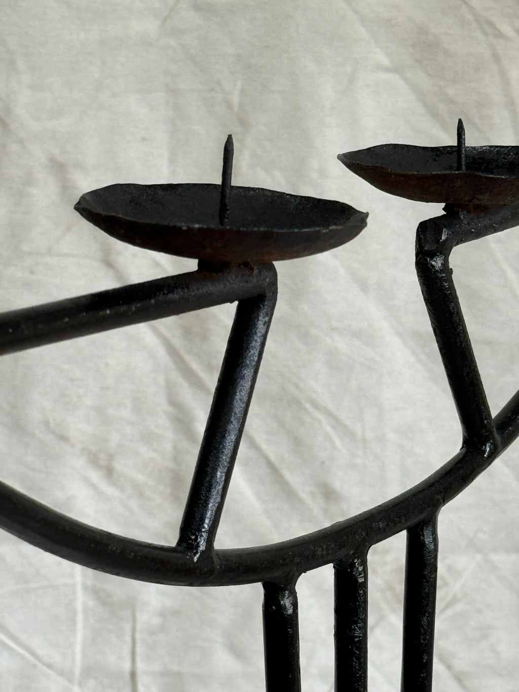 Close-up view of the Vintage Art Nouveau Wrought Iron Candle Holder showcasing its unique design. hommes + gardens estudio