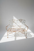 Vintage Wrought Iron Garden Bench with ornate scroll and foliage design, perfect for outdoor spaces. hommes + gardens estudio.