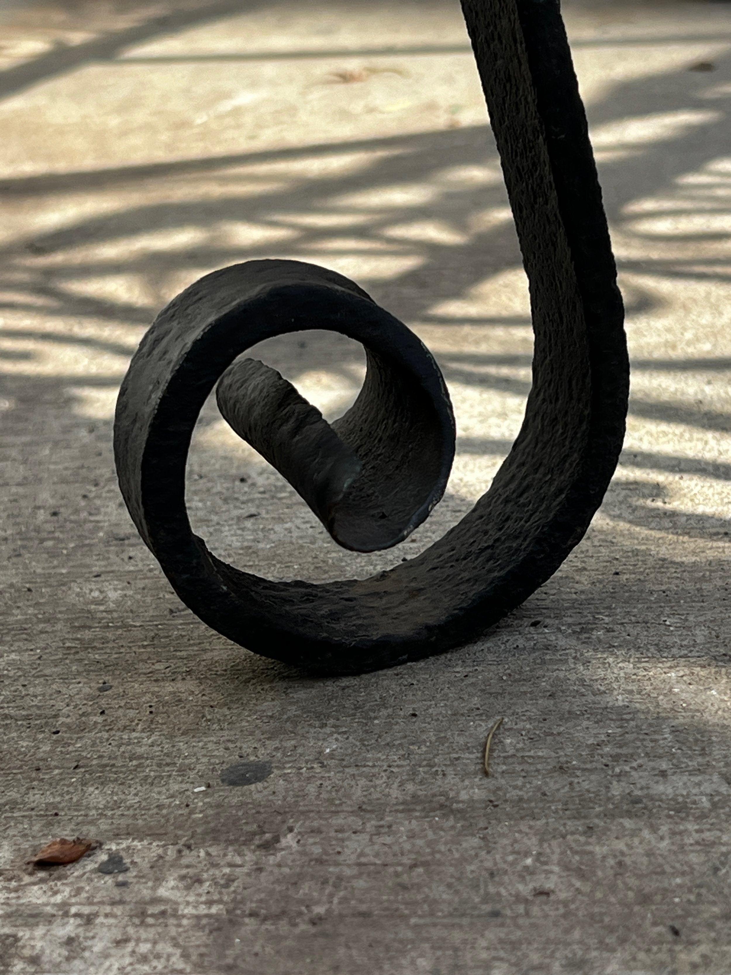 Close-up of decorative scrollwork detail on Victorian Oval Wrought Iron Plant Holder showing intricate design. hommes + gardens estudio.