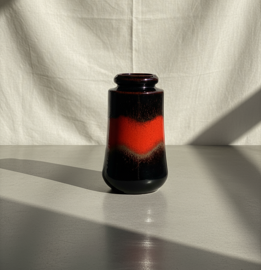 West German mid-century “Fat Lava” vase model 549-23 with fiery red and deep brown drip glaze, a vintage ceramic art piece from the 1950s–1970s modernist era — Hommes and Gardens, Decorative Collection, Home Decor, Landscape Architect, Interior Designer, Outdoor Living, Outdoor Decorations, Home Design, Luxury Design, Art, Furniture, Objects, Best Gifts, Nature, Backyard, Yard.