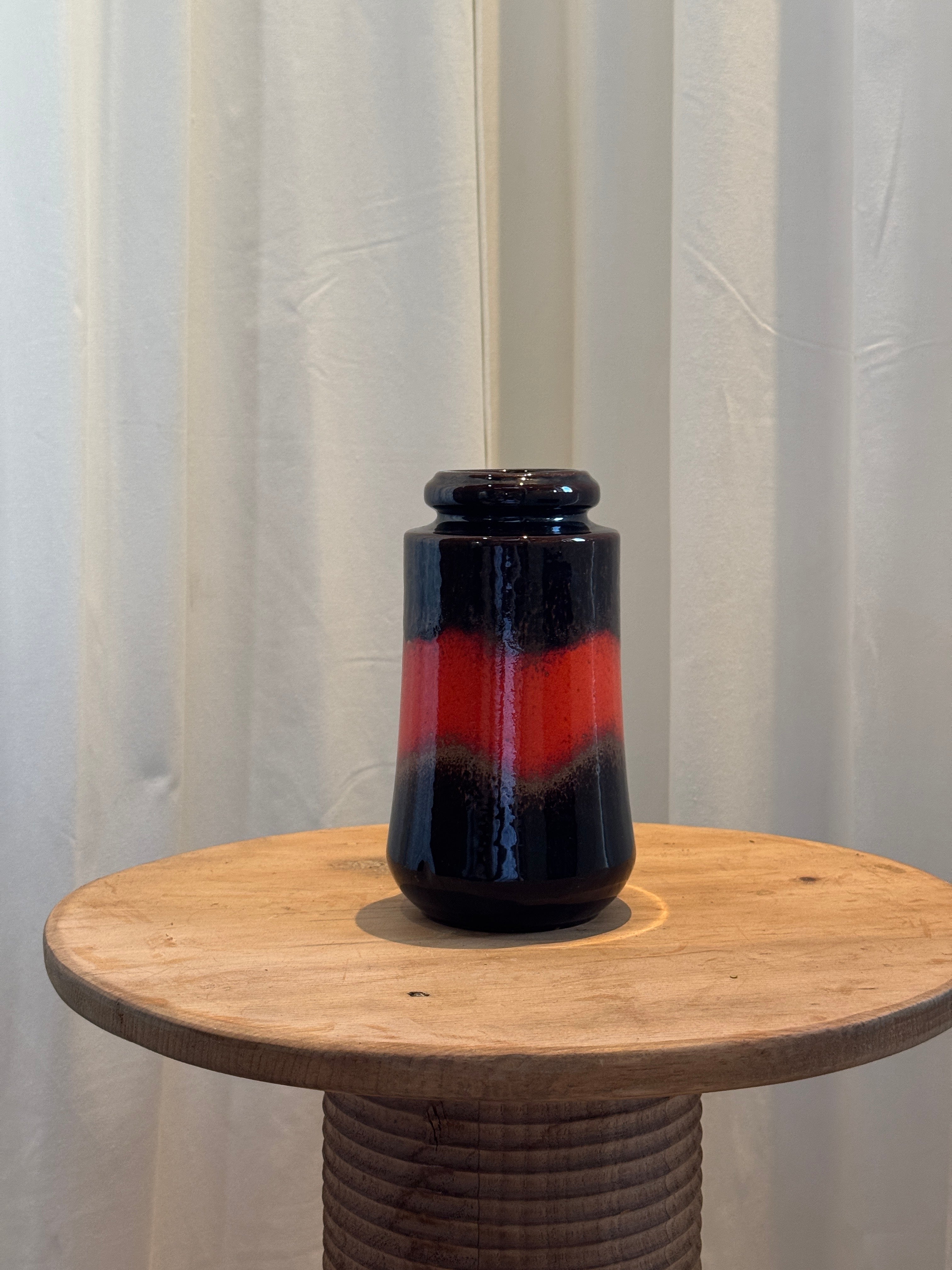 West German Mid-Century “Fat Lava” vase model 549-23, featuring glossy deep brown and fiery red drip glaze, a vintage ceramic art collectible — Hommes and Gardens, Vases + Vessels Collection, Landscape Architect, Interior Designer, Outdoor Living, Art, Furniture, Objects, Best Gifts, Nature, Backyard, Yard, Outdoor Decorations, Home Decor, Home Design, Luxury Design.