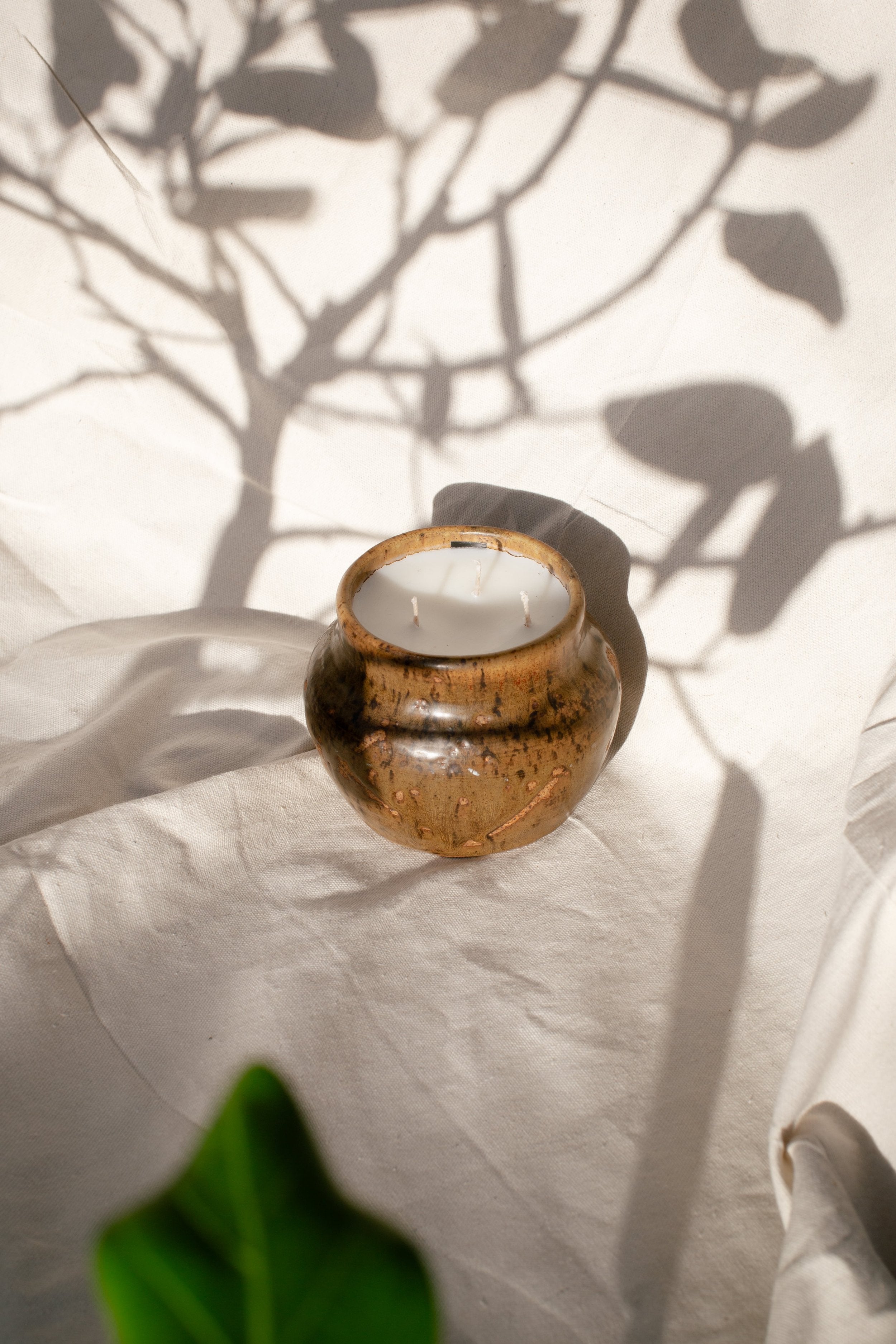 Vintage Handmade Ceramic Vase | H&G x Western Disco on a soft surface with shadows, showcasing its unique design. hommes + gardens estudio.