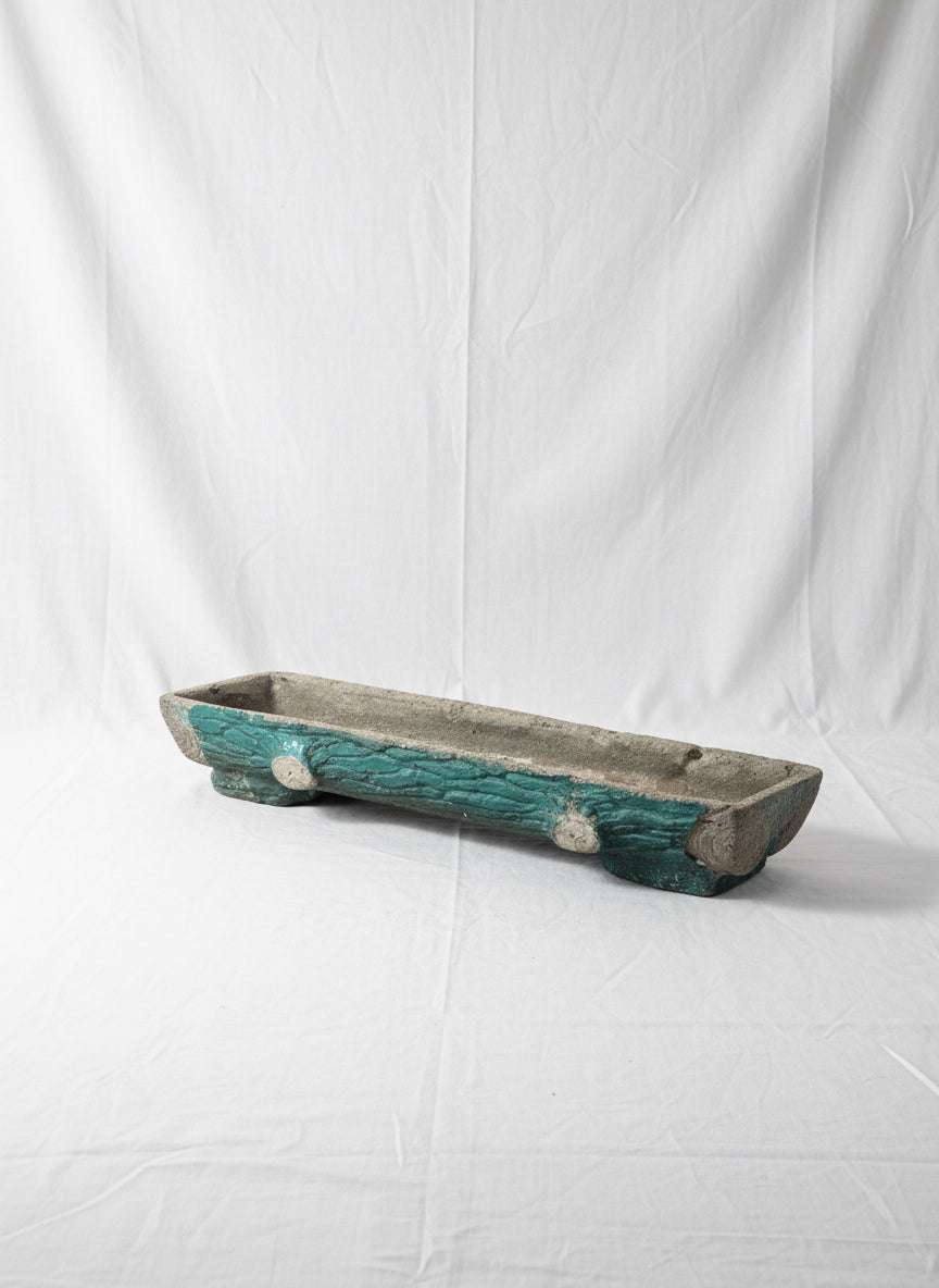 Willy Guhl Vintage Cast Concrete Trough Planter, Rectangular Swiss Design on display, showcasing its unique shape and color accents. hommes + gardens estudio.