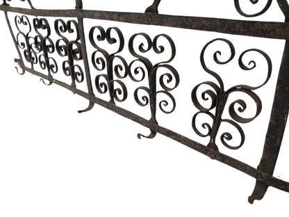 Close-up of antique wrought iron wall rack showing hand-forged bird motif and decorative scroll details — Hommes and Gardens, Home Decor Collection, Wallscape, landscape design, plant design, Landscape Architect, Interior Designer, Outdoor Living, Outdoor Decorations, Home Design, Luxury Design, Art, Furniture, Objects, Best Gifts, Nature, Backyard, Yard.