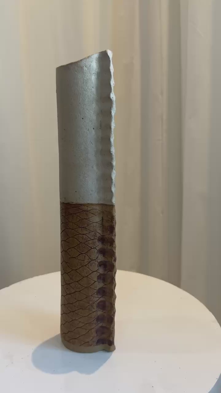 Bosigo Studio 1970s Lesotho tall handcrafted pinched pottery vase featuring earthy tones, textured lower body, and smooth unglazed upper section — Hommes and Gardens, Vases + Vessels Collection, Landscape Architect, Interior Designer, Outdoor Living, Art, Furniture, Objects, Best Gifts, Nature, Backyard, Yard, Outdoor Decorations, Home Decor, Home Design, Luxury Design.