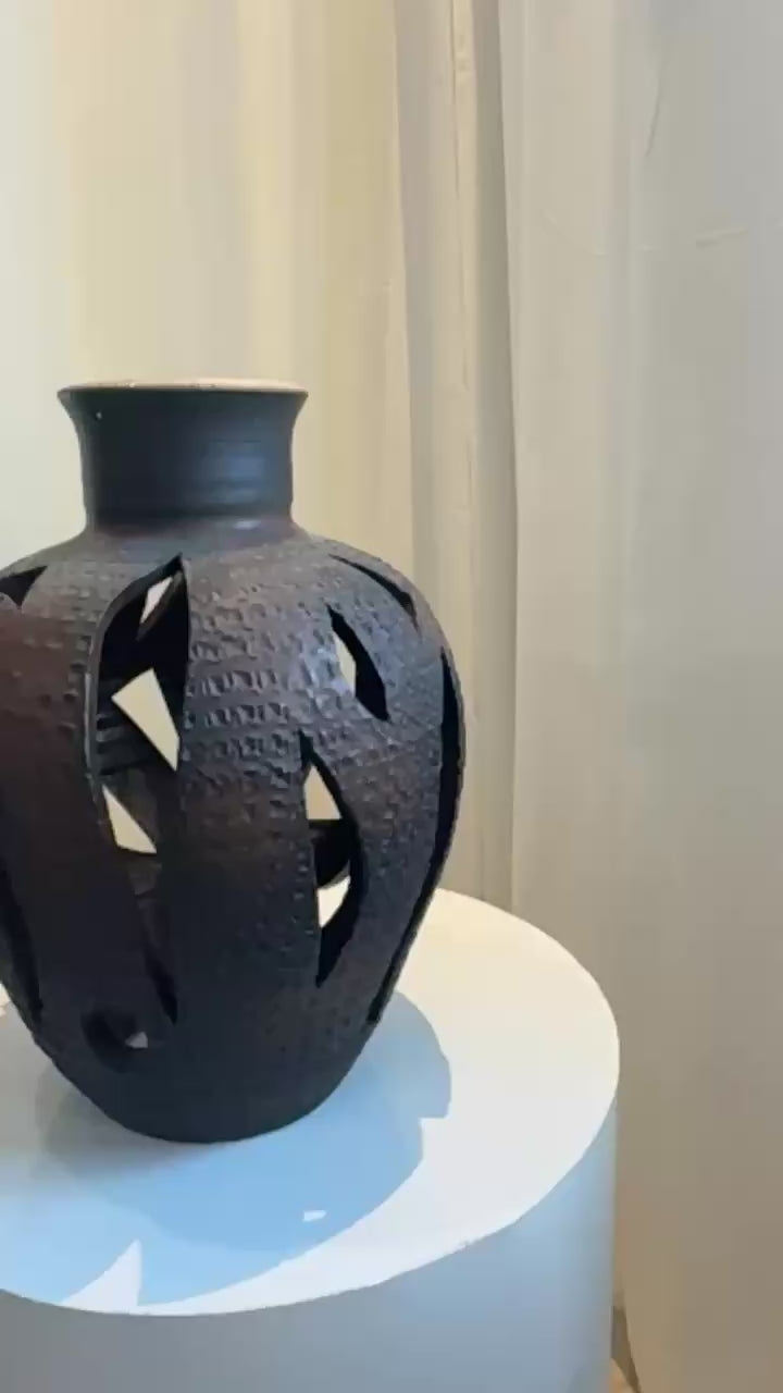 Mid-century openwork ceramic vase inspired by David Cressey, architectural pottery design with intricate cutouts and rich brown patina — Hommes and Gardens, Objects + Vases & Vessels Collection, Landscape Architect, Interior Designer, Outdoor Living, Art, Furniture, Objects, Best Gifts, Nature, Backyard, Yard, Outdoor Decorations, Home Decor, Home Design, Luxury Design.